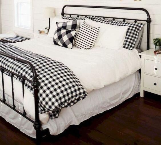Black Bed Frame with Checkered Bedding