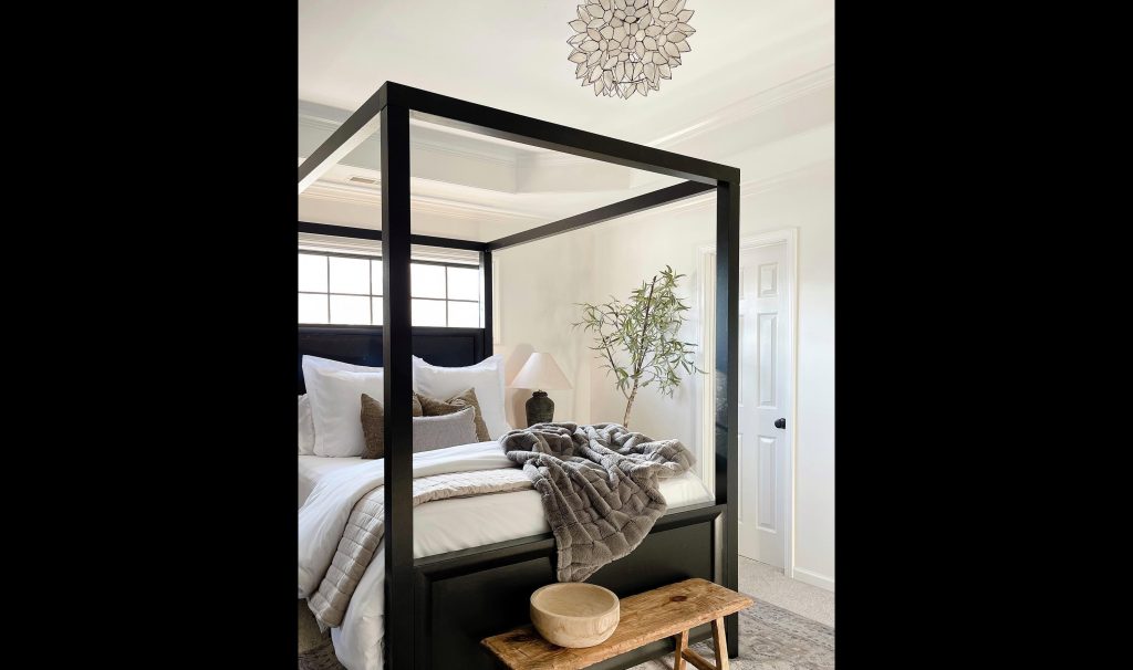 Black Canopy Bed Frame in A White Room