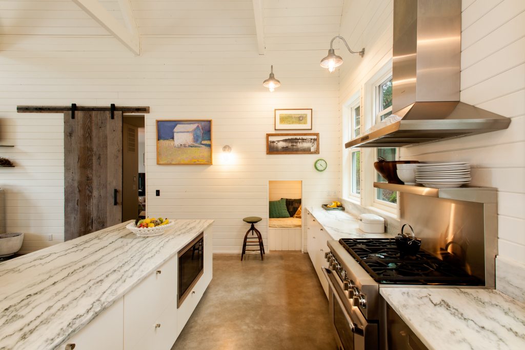 Farmhouse Style Kitchen with U-Shaped Concrete Stained Floor
