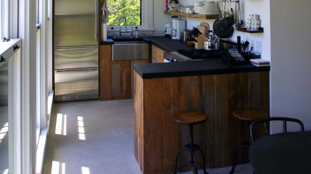 Kitchen with Peninsula and Concrete Stained Floor