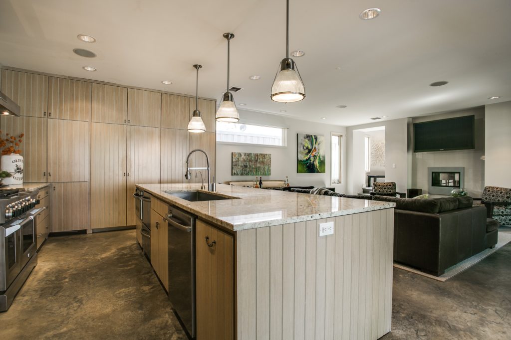 Open Farmhouse Kitchen with Concrete Floor and Breakfast Nook